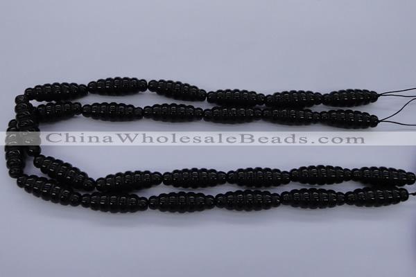 CAG1695 15.5 inches 10*30mm carved rice black agate beads